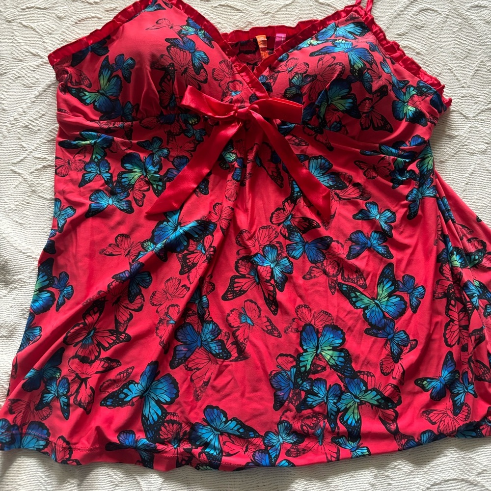 2 piece chamois and shirt pant with ruffles at the bottom of both pieces.